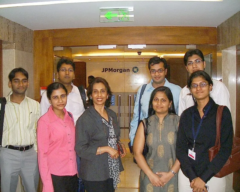 Maya Daswani with participants after a JPMorgan workshop