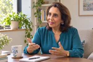Illustration of Maya Daswani speaking confidently in a coaching conversation
